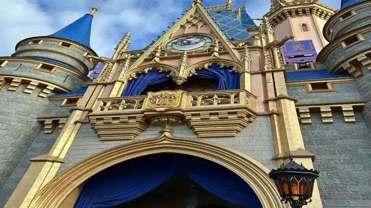 Disney World castle with families enjoying the park