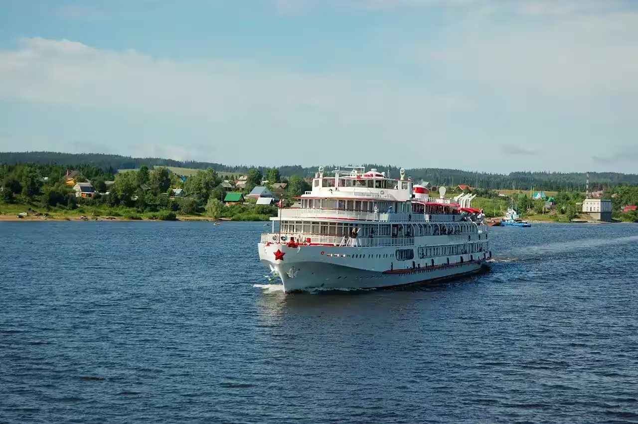 River cruise ship passing through a European village