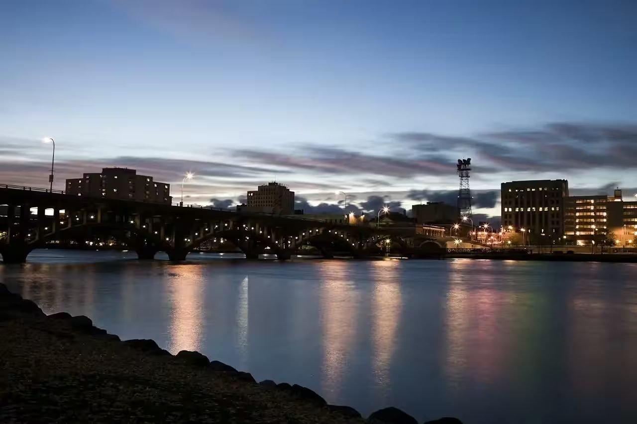 Travel advisor helping a family plan their vacation at a desk